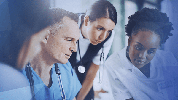 Healthcare workers looking at something together
